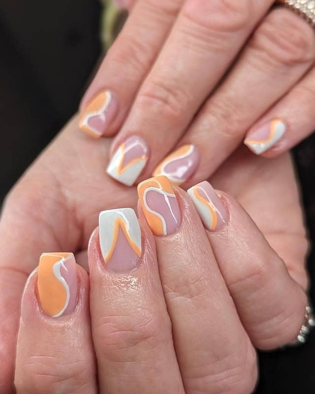 11. Short Square Nude Nails with Orange and White Swirl Tips - orange and white nail ideas