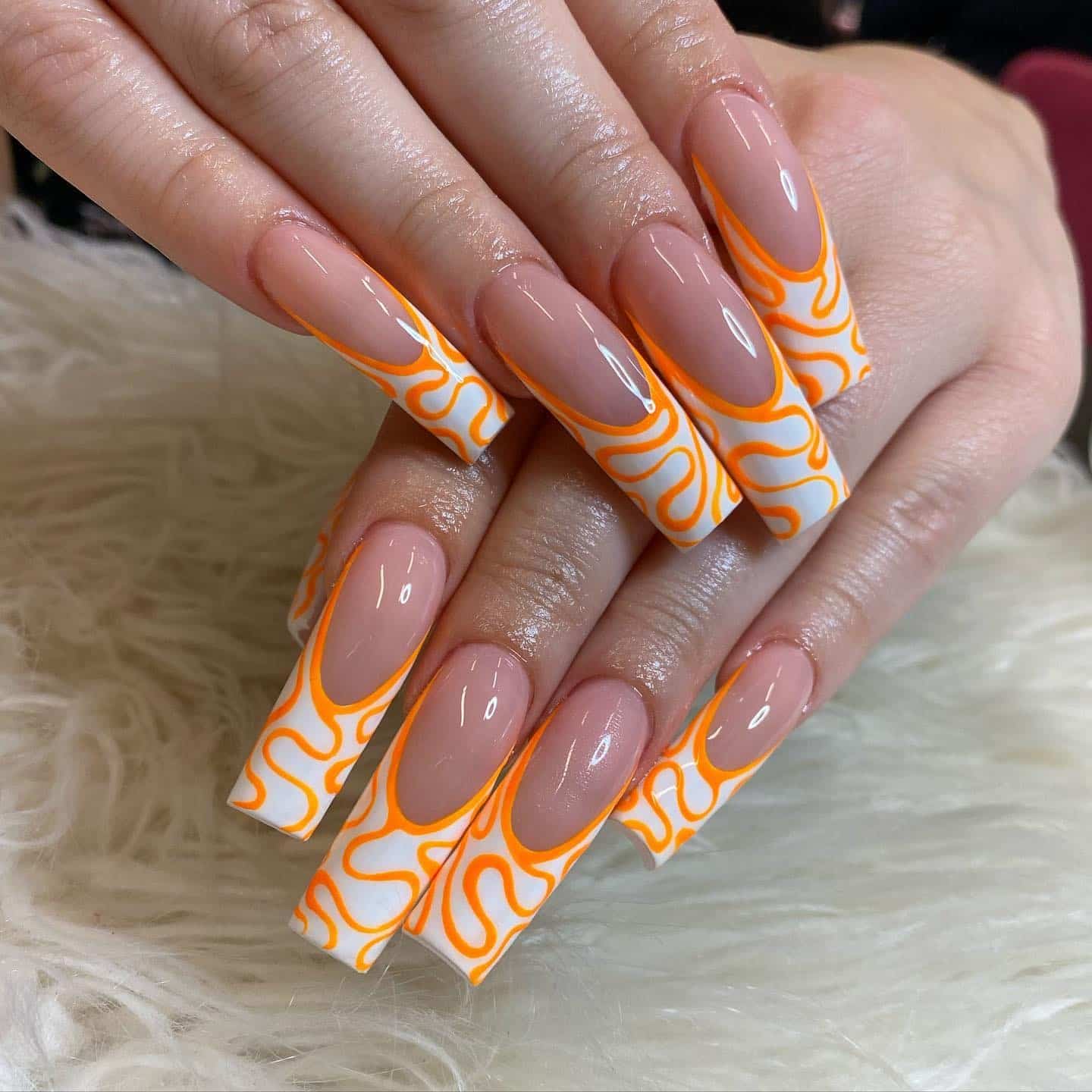 19. Long Coffin Nails with Orange and White Swirl Pattern - orange and white nail ideas