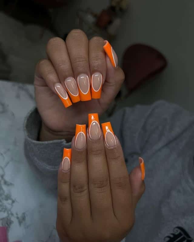 20. Orange French Coffin Nails with Nude Base - orange and white nail ideas