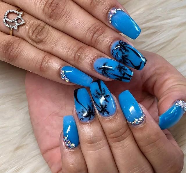 7. Electric Blue Palm Statement Nails - palm tree nail ideas