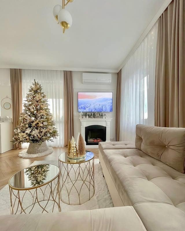 11. Soft Neutral Christmas Living Room with Gold Accents - christmas living room decor ideas