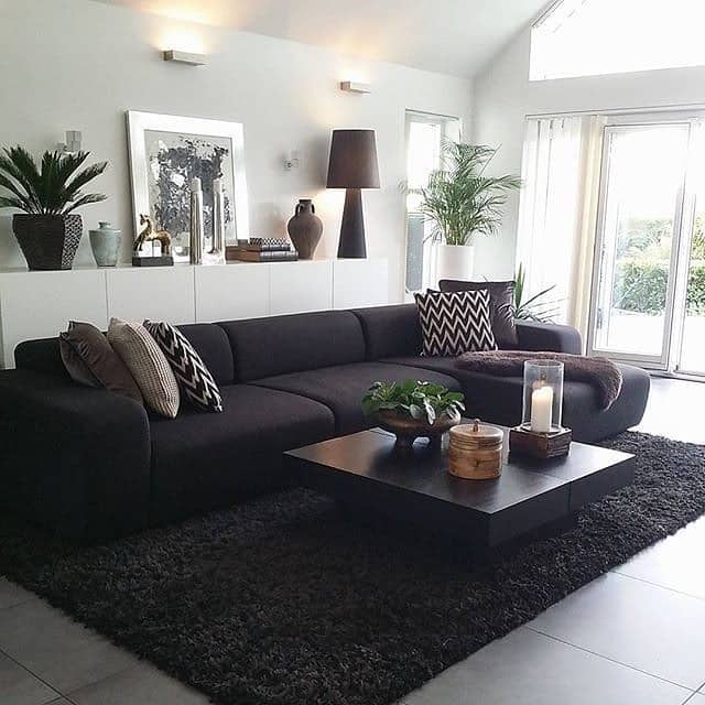7. Minimalist Black Furniture Living Room with Layered Textures - black furniture living room ideas
