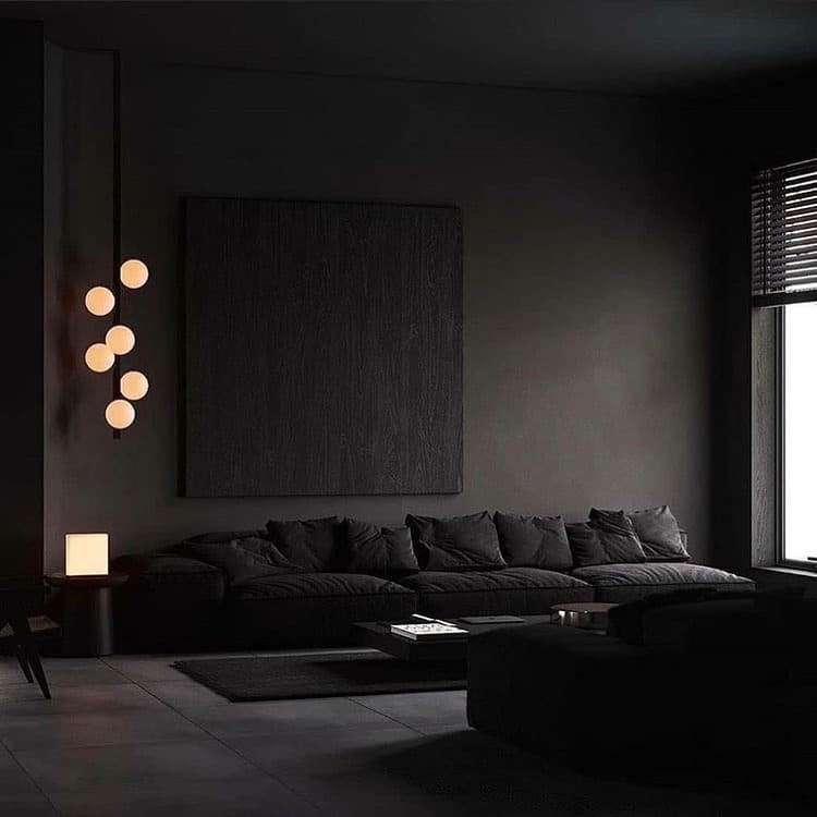 8. Moody Black Living Room with Low Seating and Ambient Lighting - black furniture living room ideas