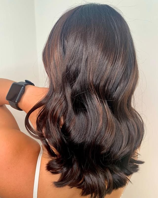8. Rich Brunette Waves with Soft Caramel Ribbons - Dark Brown Hair with Highlights