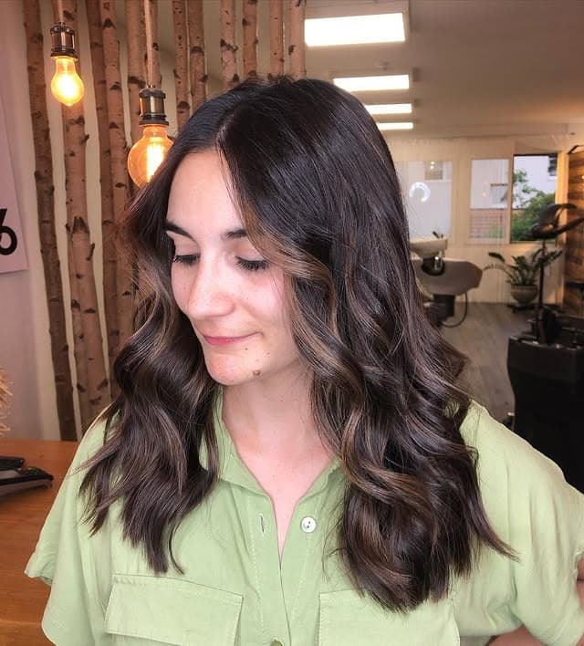 10. Deep Brown Waves with Natural Sunlit Accents - Dark Brown Hair with Highlights