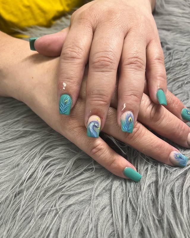 1. Teal Peacock Feather Accent Nails - peacock nail ideas