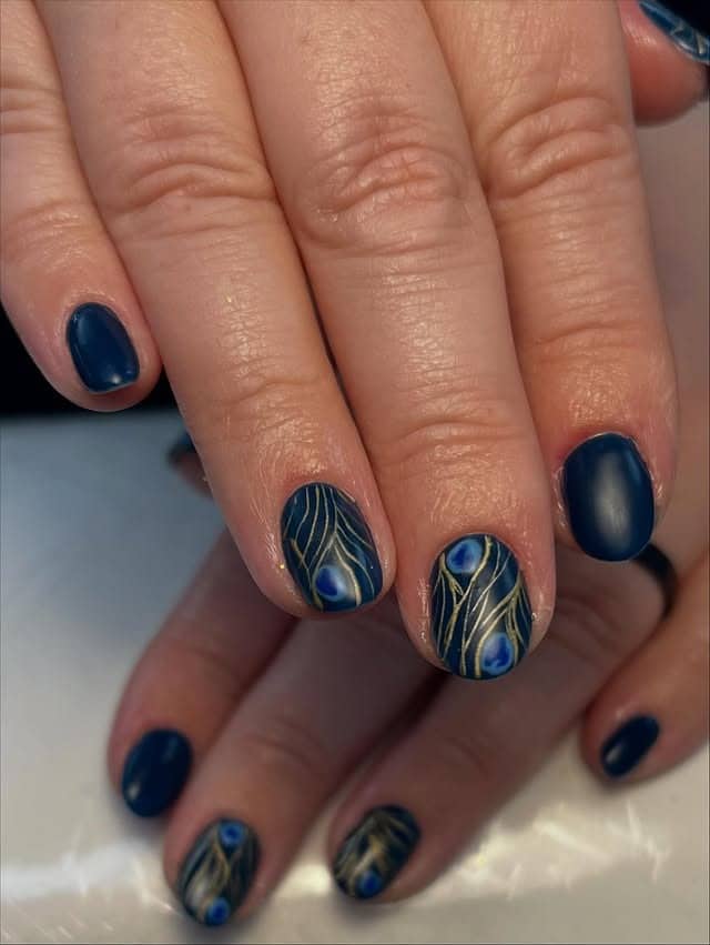 11. Midnight Blue Peacock Line Art Nails - peacock nail ideas