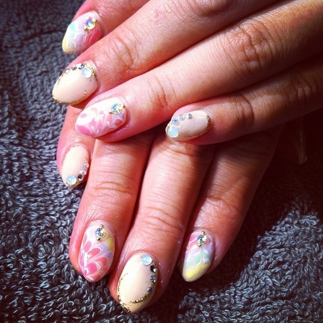 13. Pastel Peacock Marble Crystal Nails - peacock nail ideas