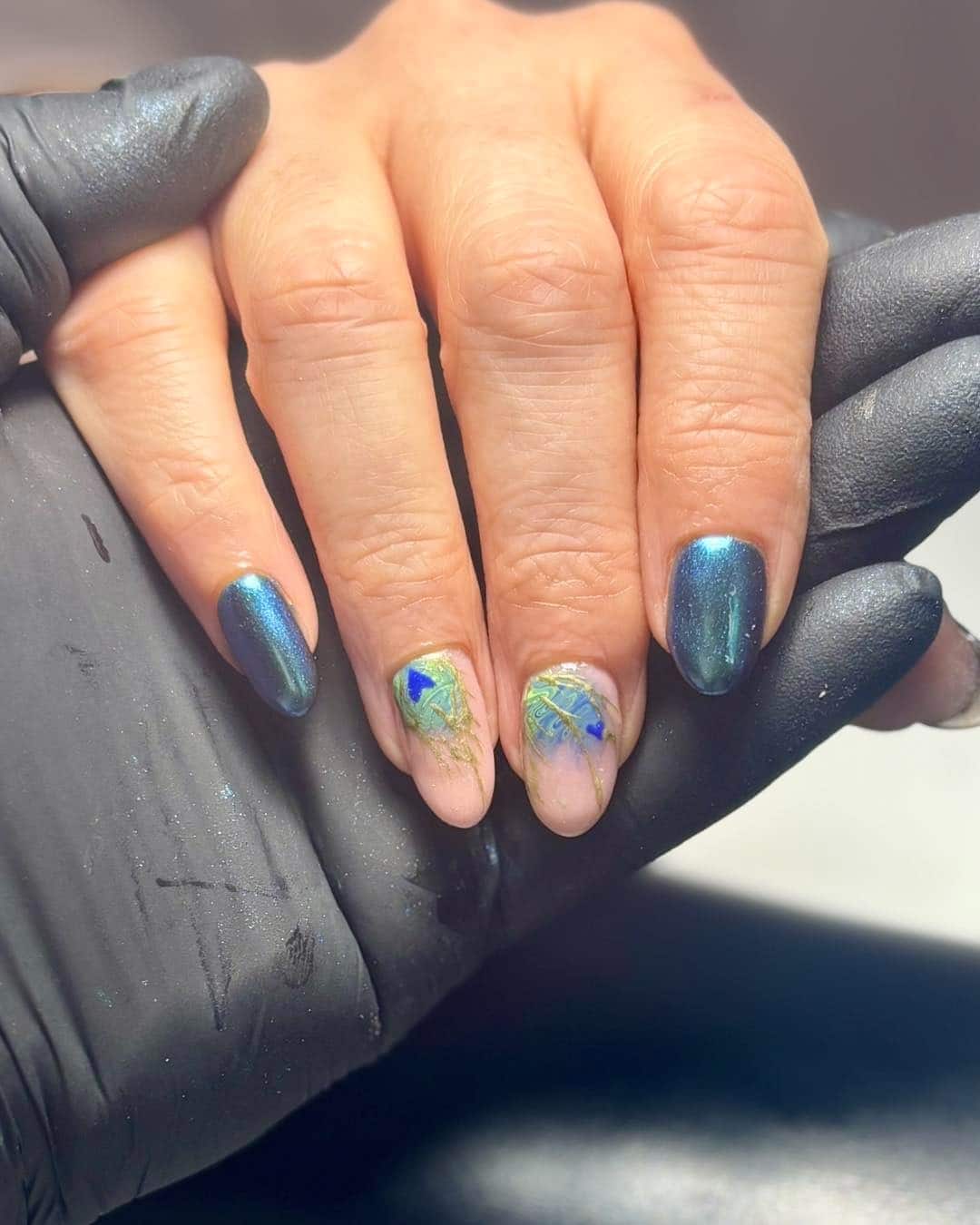 15. Teal Chrome Peacock Accent Nails - peacock nail ideas