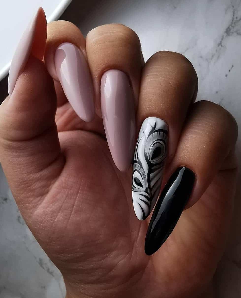 18. Monochrome Peacock Feather Stiletto Nails - peacock nail ideas