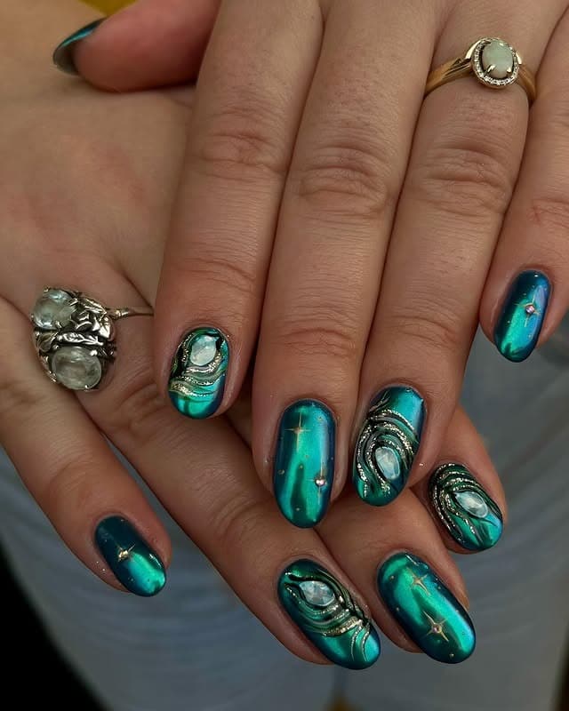 21. Teal Chrome Peacock Eye Nails - peacock nail ideas