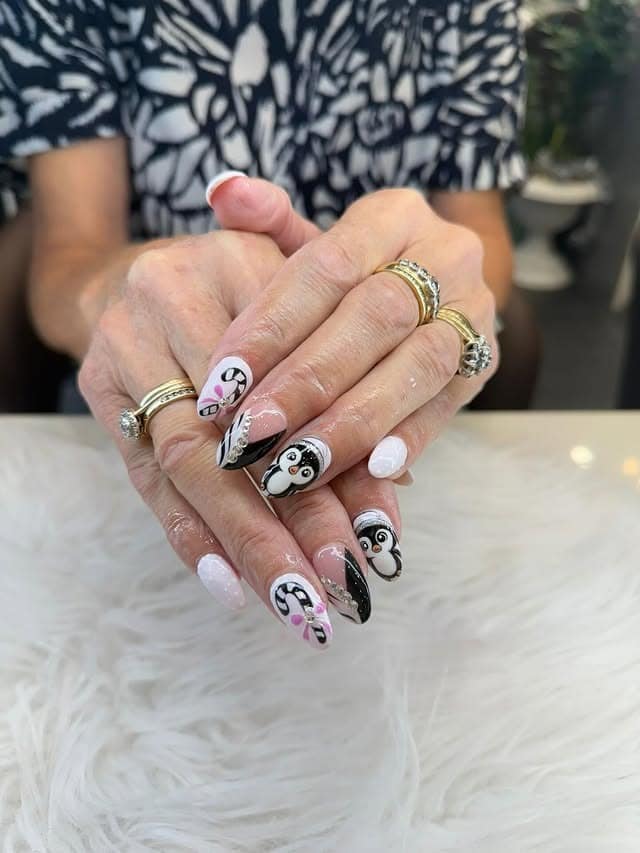 5. Soft Pink Holiday Penguin Nails - penguin nail ideas