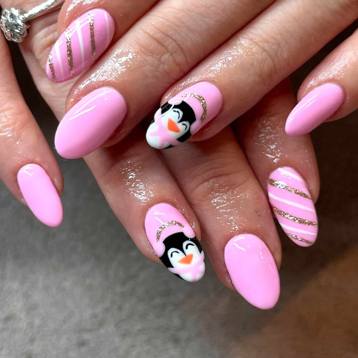 11. Blush Pink Penguin Glitter Accent Nails - penguin nail ideas