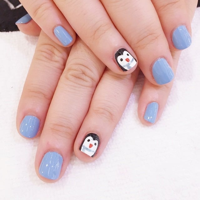 15. Powder Blue Minimal Penguin Nails - penguin nail ideas