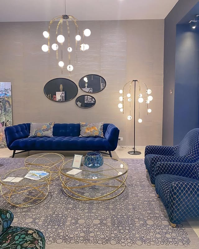 19. Modern Blue Lounge with Sculptural Lighting - navy blue and gray living room ideas