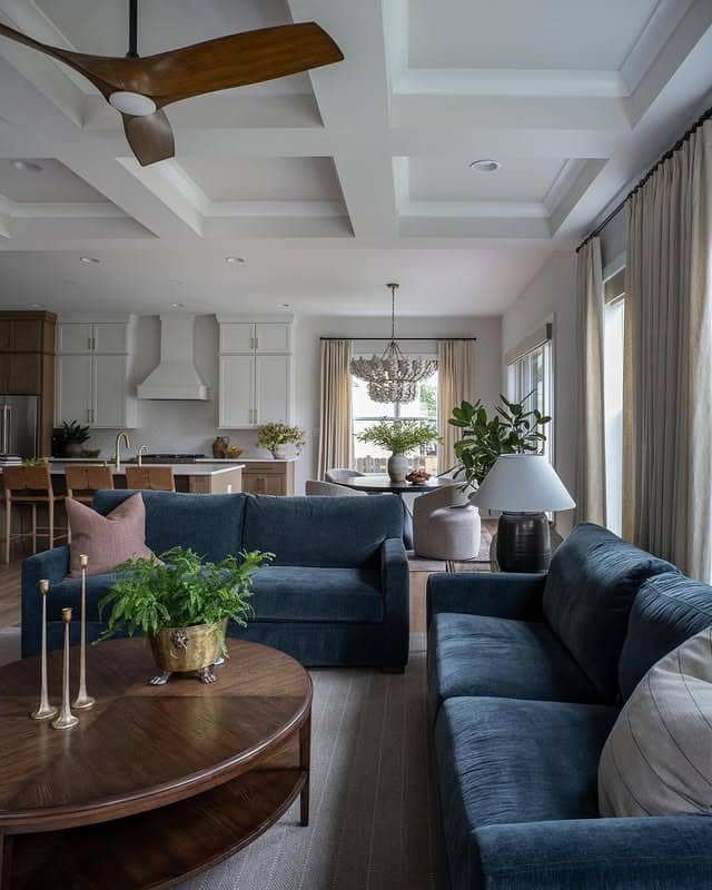 21. Open-Concept Navy Seating with Soft Gray Architecture - navy blue and gray living room ideas