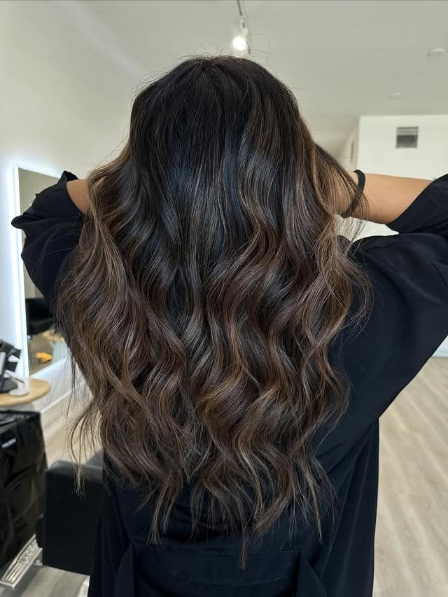 6. Long Textured Waves with Subtle Ash Highlights - Medium Brown Hair with Highlights