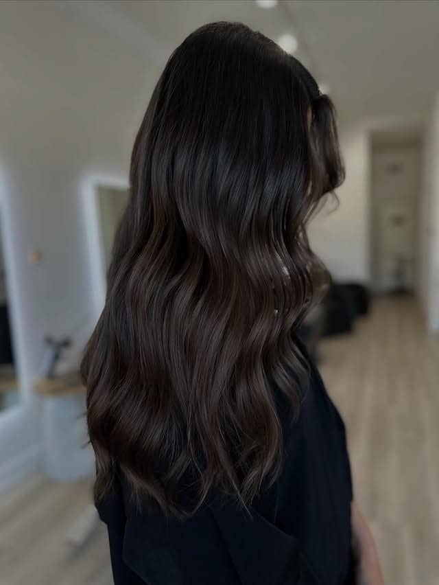 10. Soft Waves with Deep Brown Base and Lived-In Highlights - Medium Brown Hair with Highlights