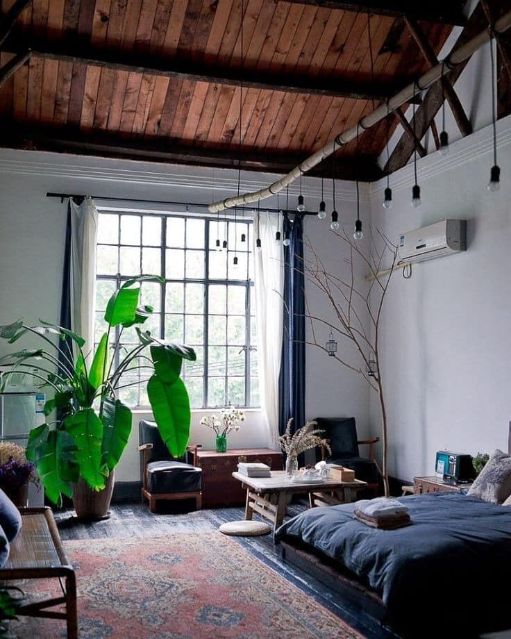 1. Urban Loft Bedroom with Botanical Layers and Warm Neutrals - nature bedroom ideas