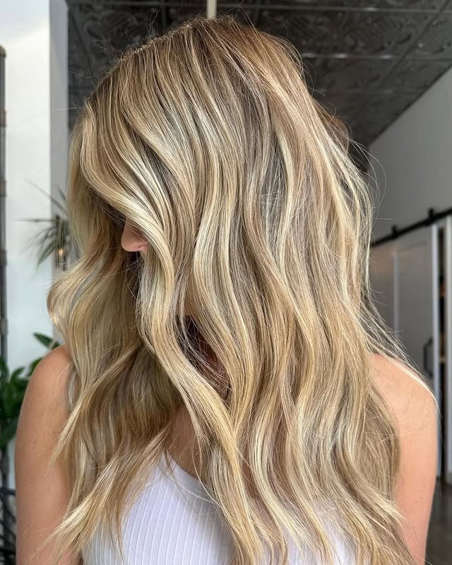 8. Neutral Blonde Waves with Lived-In Dimension - Fall Hair Colors