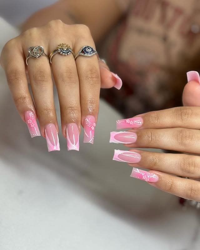 13. Pink French Tip Nails with Floral Line Art - pink spring nail ideas