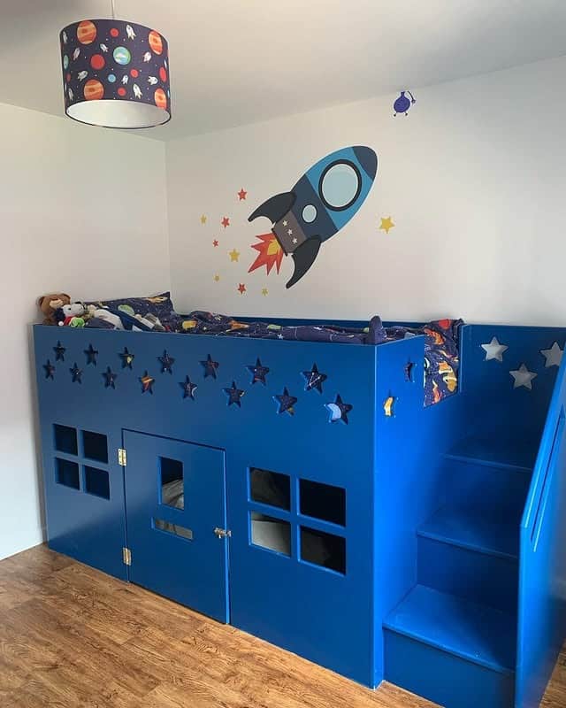 14. Rocket Feature Bed Bedroom in Bright Blue and White - space bedroom ideas