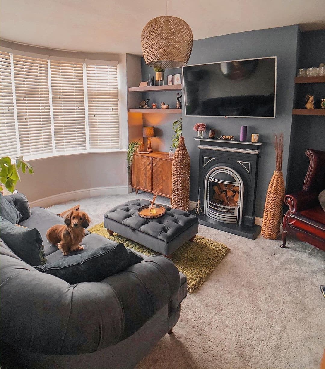 5. Warm Dark Grey Living Room with Natural Textures - dark grey living room ideas