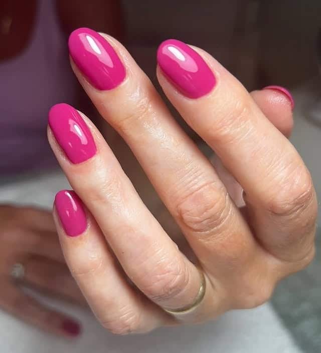 18. Glossy Raspberry Pink Oval Nails - pink summer nail ideas