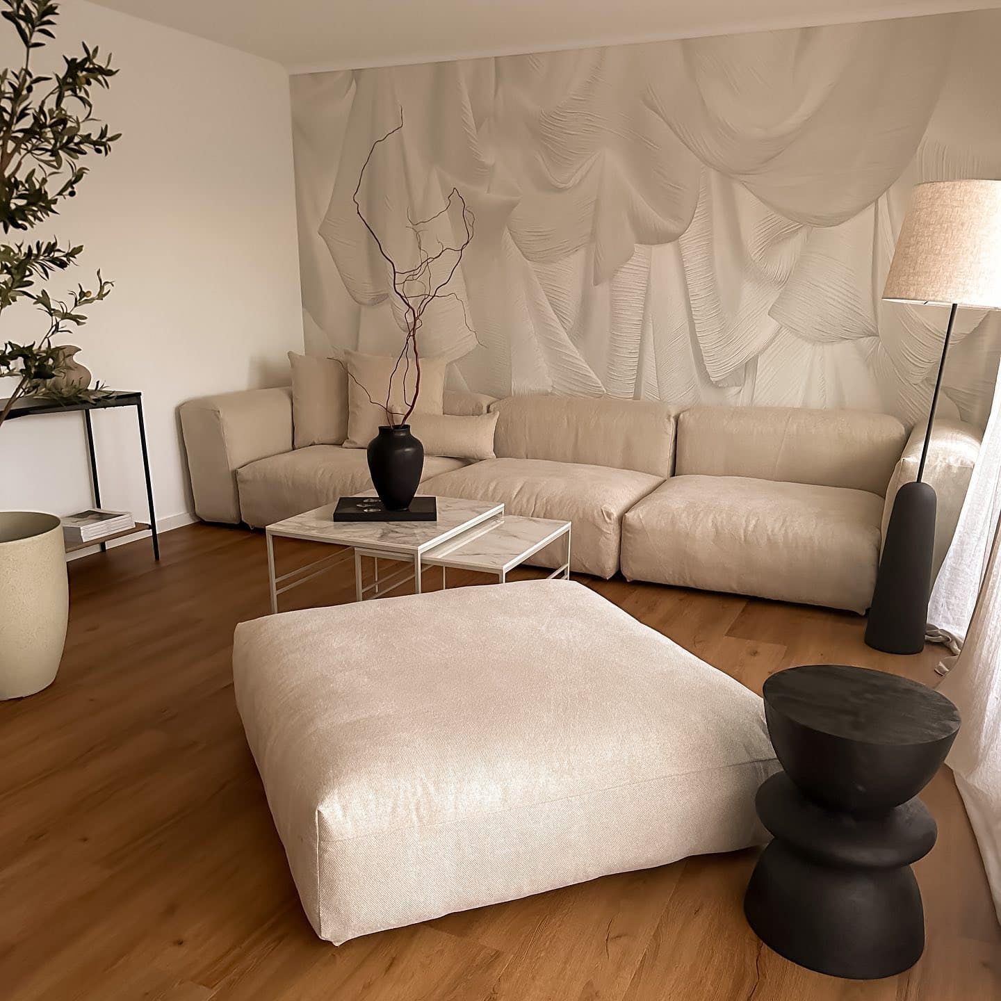 7. Textured Beige Living Room with Statement Wall - beige couch living room ideas