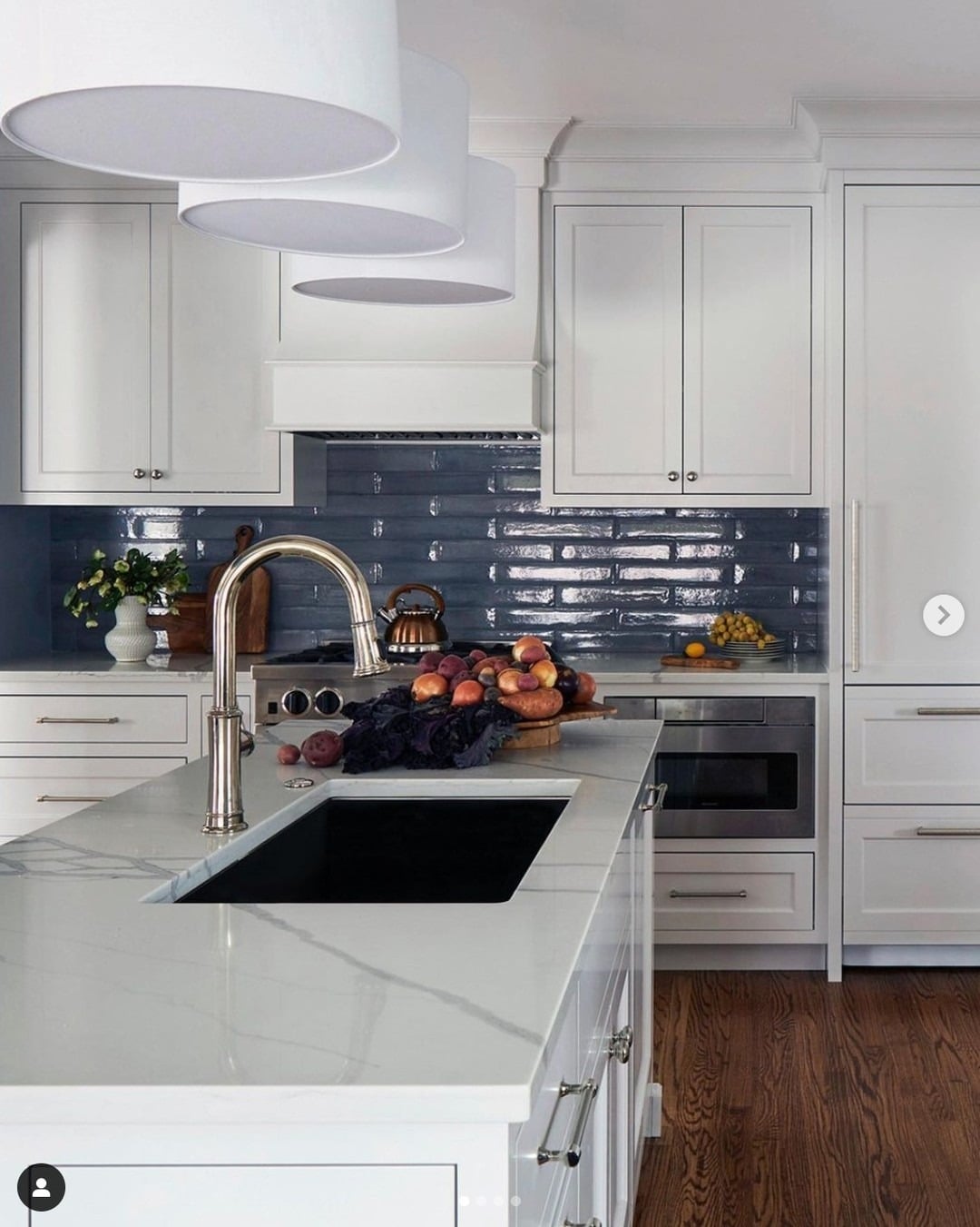 4. Polished White Kitchen with Glossy Navy Subway Tile - blue backsplash kitchen ideas