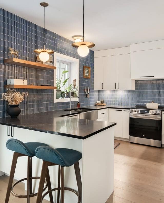 10. Refined Island Kitchen with Blue Mosaic Tile Feature - blue backsplash kitchen ideas