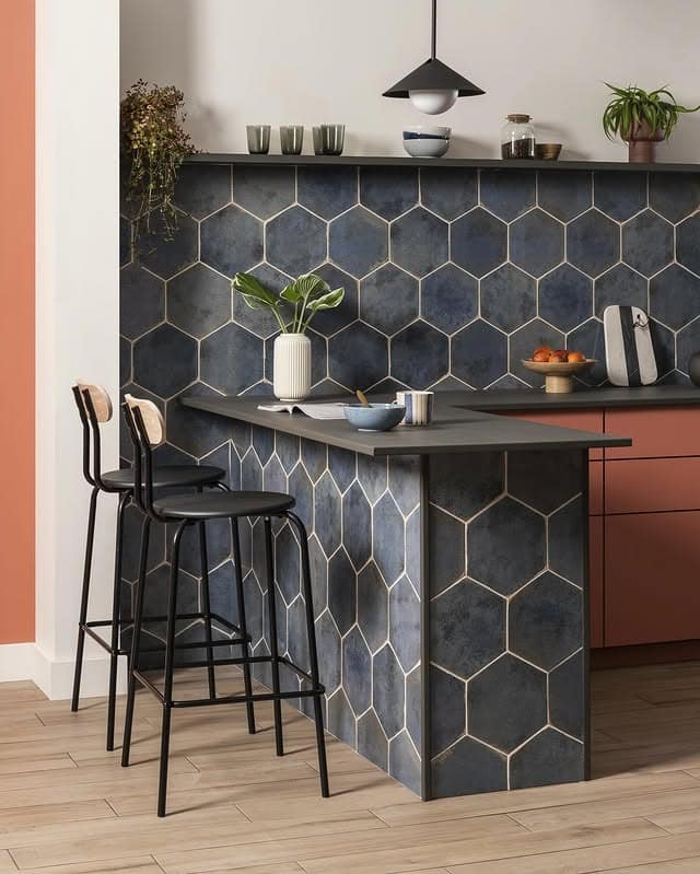 12. Modern Kitchen Island Wrapped in Charcoal Blue Hex Tile - blue backsplash kitchen ideas