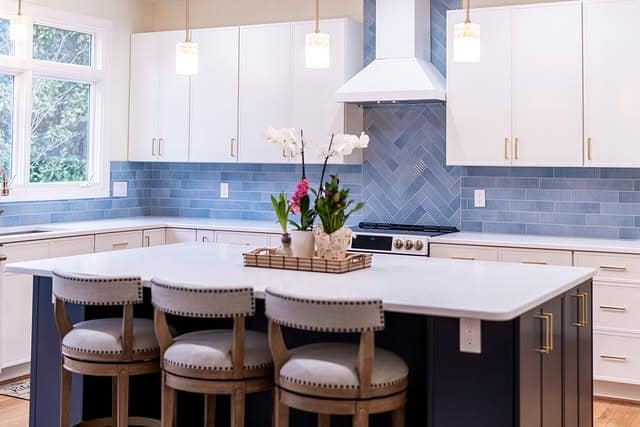 13. Bright Transitional Kitchen with Soft Blue Subway Tile - blue backsplash kitchen ideas