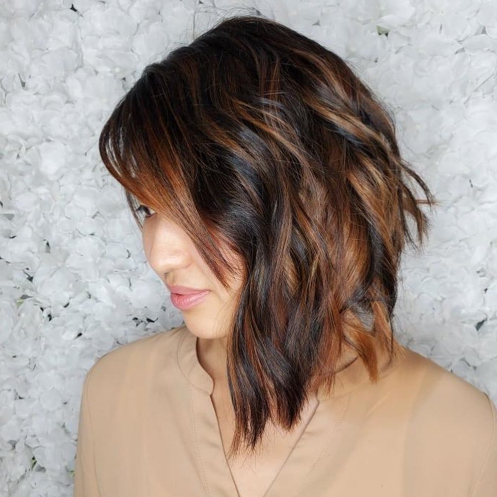 3. Textured Asymmetrical Bob with Warm Copper Accents - Asymmetrical Hairstyles