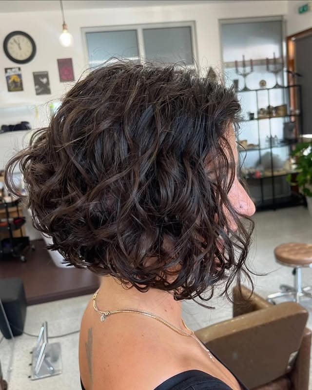 12. Curly Asymmetrical Bob in Natural Dark Brown - Asymmetrical Hairstyles