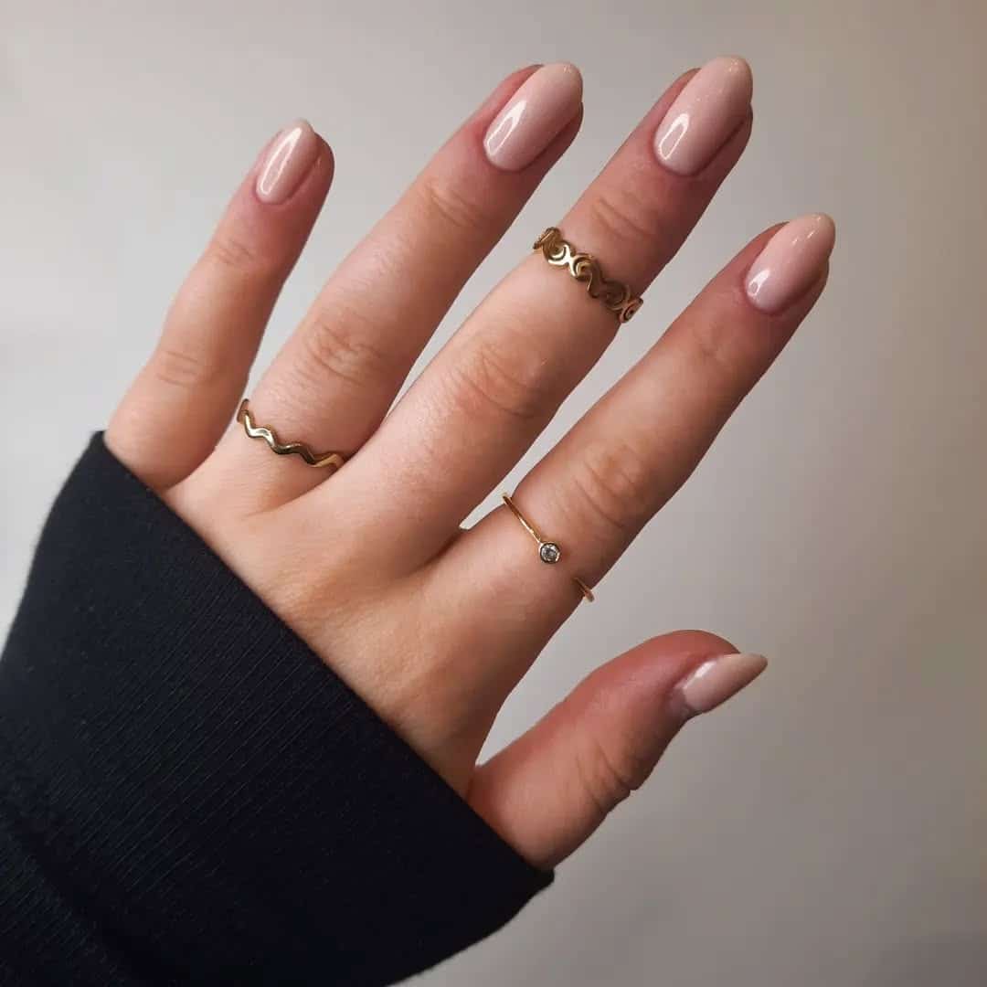 8. Soft Nude Oval Nails with Gloss Finish - plain nail ideas