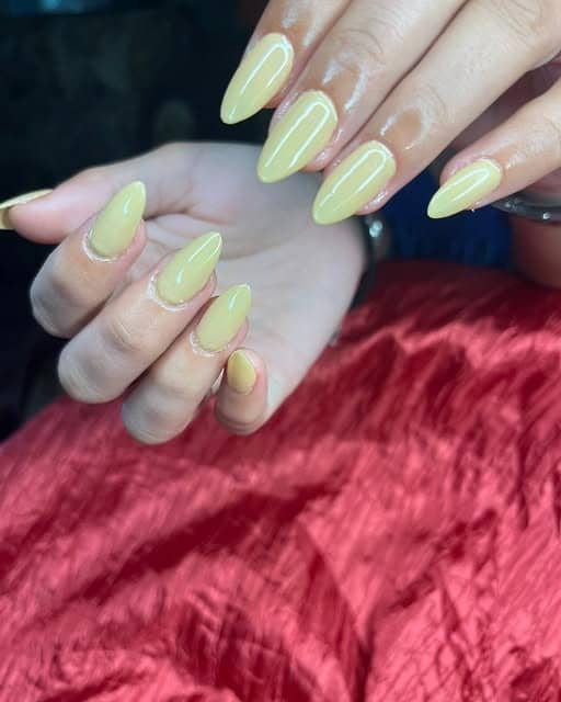 16. Soft Yellow Almond Nails - plain nail ideas