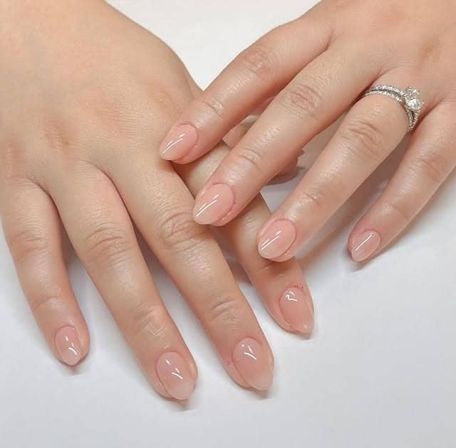17. Sheer Peach Short Oval Nails - plain nail ideas