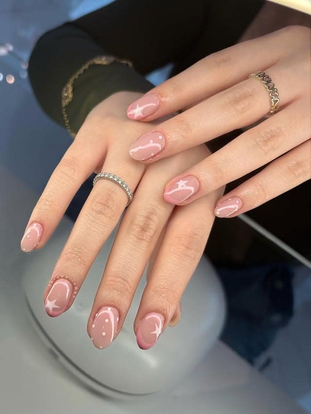 15. Soft Pink Oval Nails with Minimal Star Accents - pretty pink nail ideas