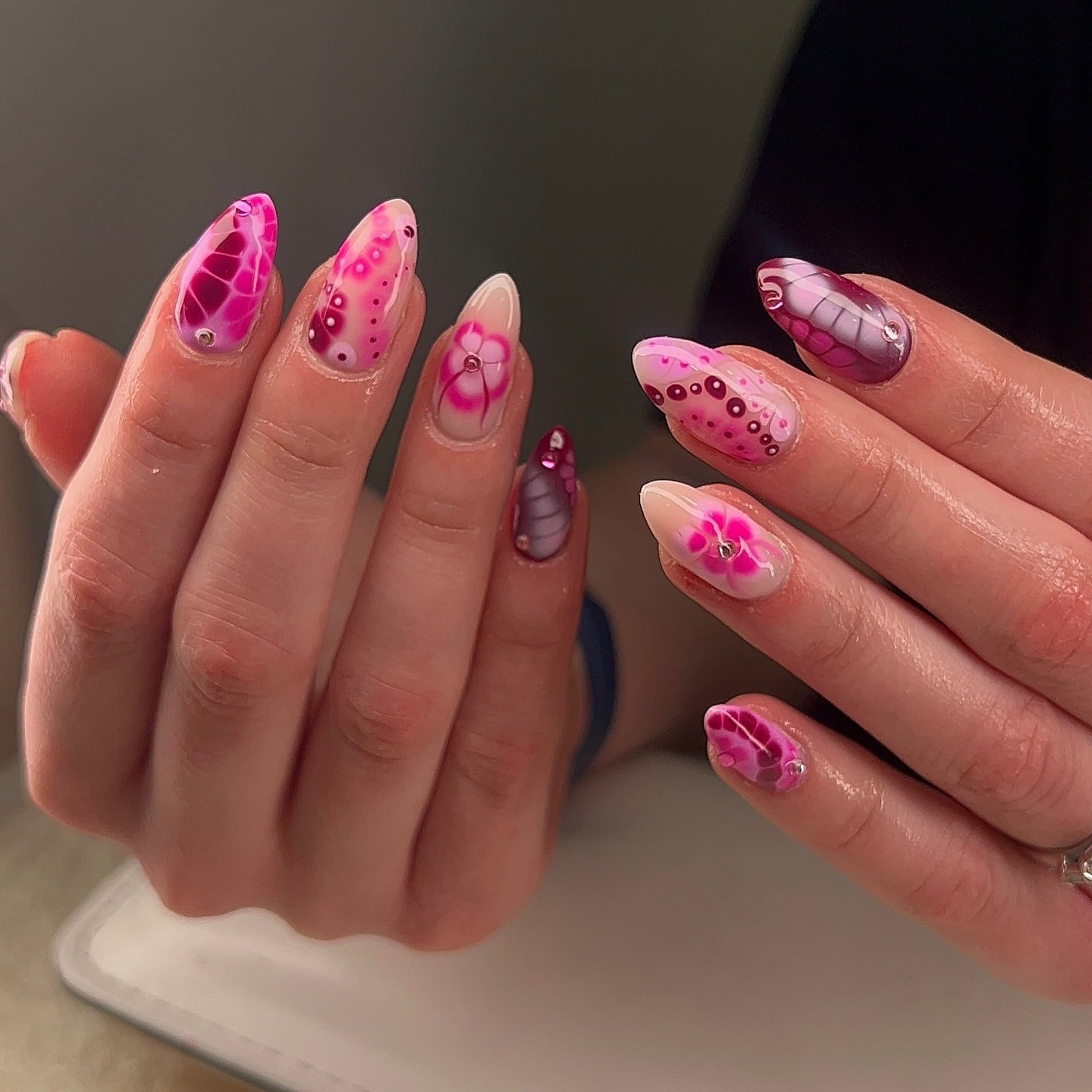 16. Abstract Pink Almond Nails with Artistic Dot Work - pretty pink nail ideas