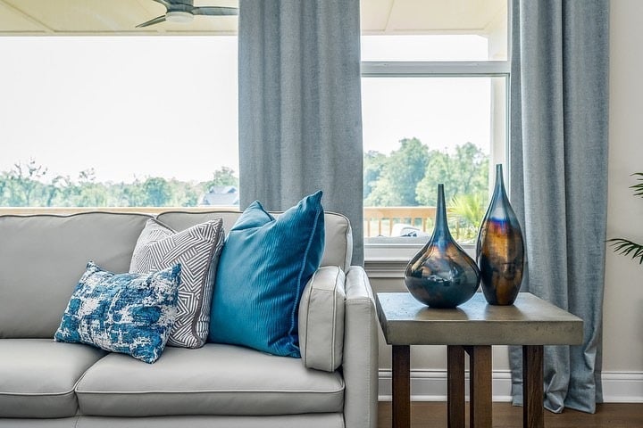 2. Airy Gray Sofa with Teal Accent Styling - gray and teal living room ideas