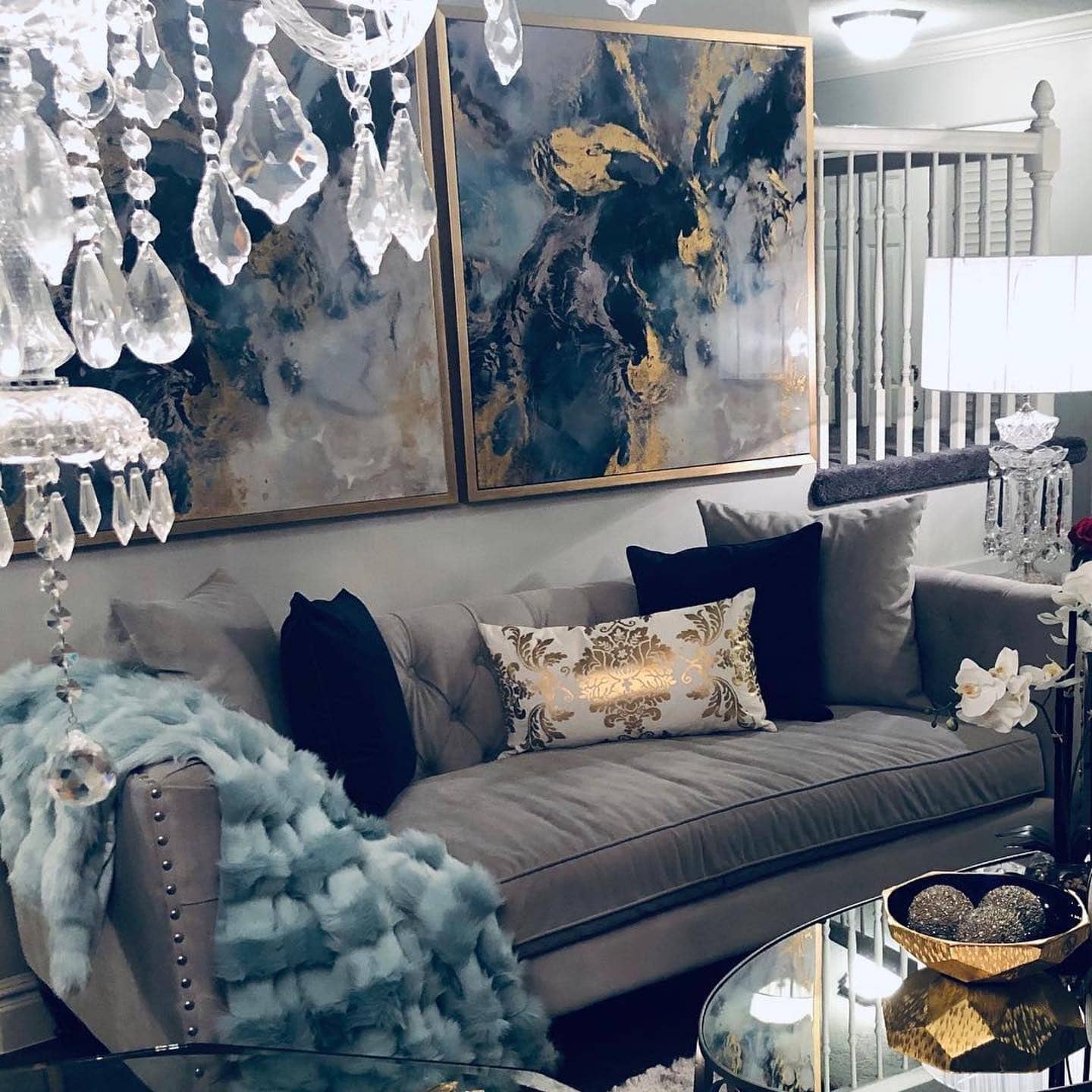 16. Elegant Gray Sofa with Teal and Gold Artwork - gray and teal living room ideas