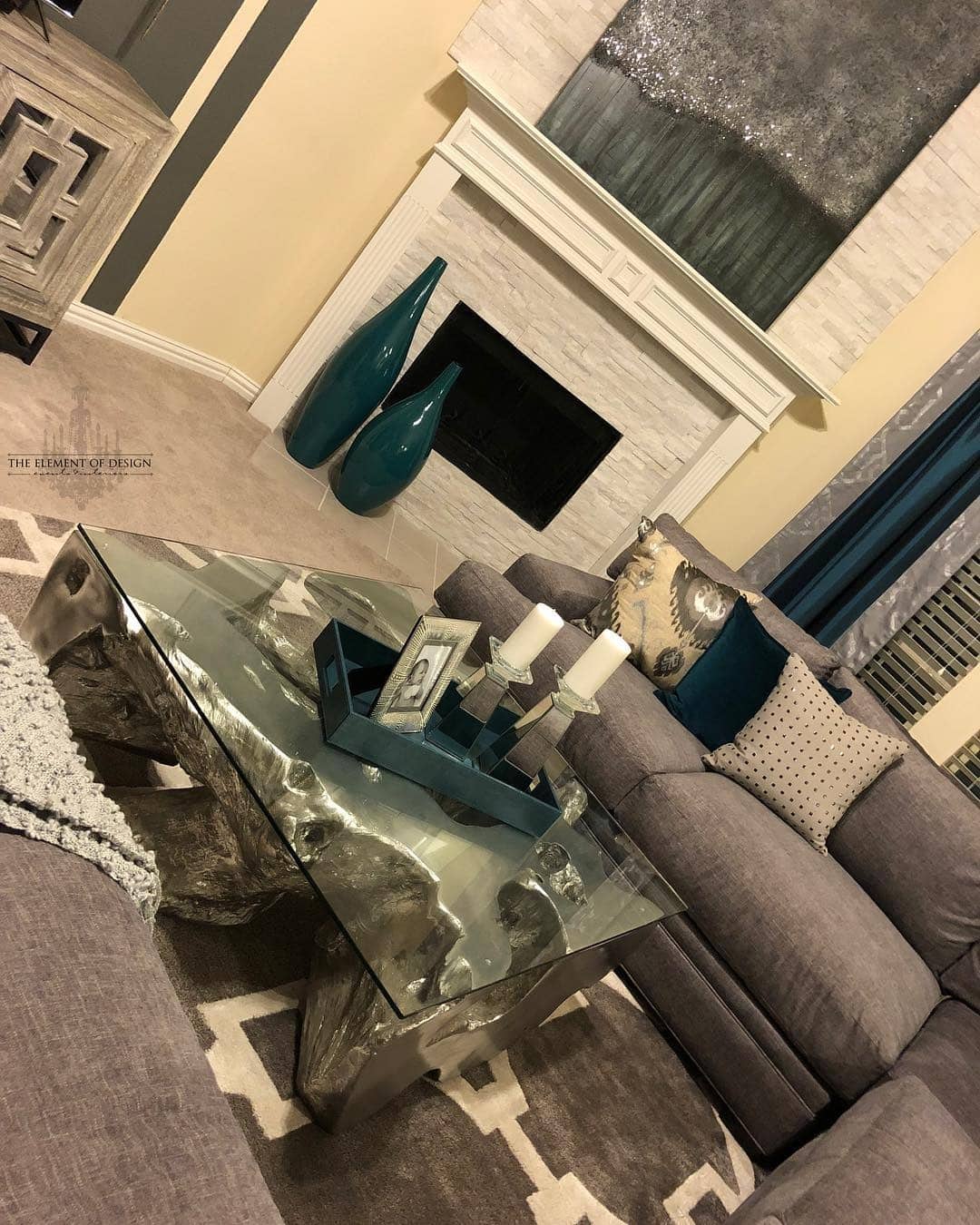 21. Modern Gray Living Room with Teal Sculptural Accents - gray and teal living room ideas