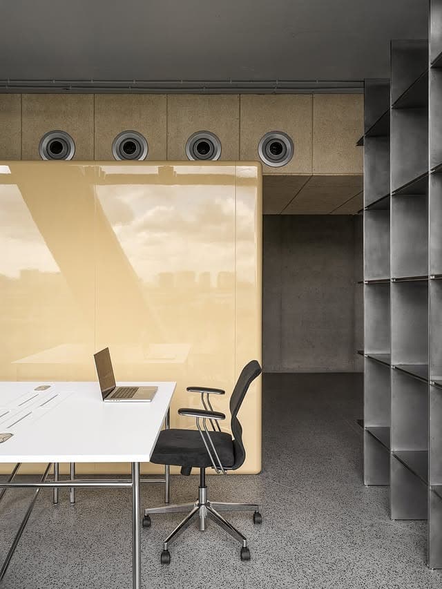 5. Architectural Minimal Office in Concrete and Warm Neutral Tones - old money office ideas