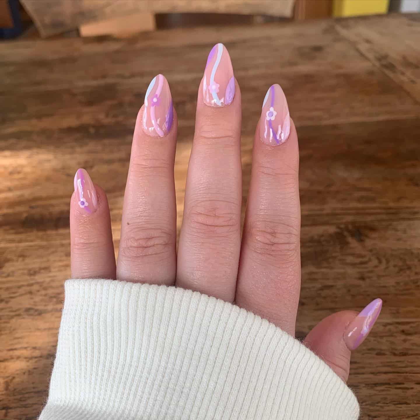 3. Pastel Purple Floral Wave Nails - purple flower nail ideas