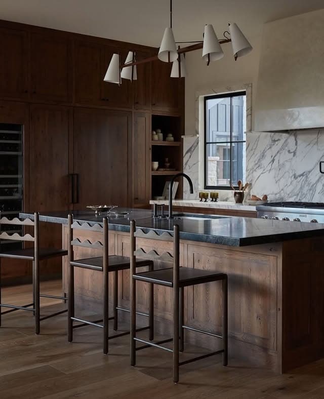 5. Classic Dark Wood Kitchen with Traditional Craft Details - dark wood kitchen ideas