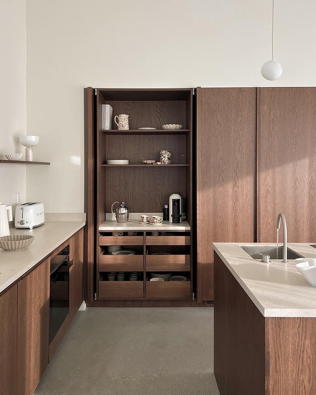 15. Warm Modern Dark Wood Kitchen with Integrated Storage - dark wood kitchen ideas