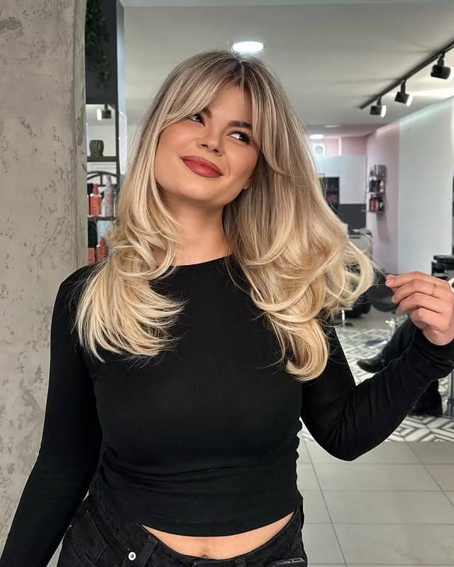 8. Long Straight Blowout with Face-Framing Bangs in Cool Brunette - Straight Hairstyles with Bangs