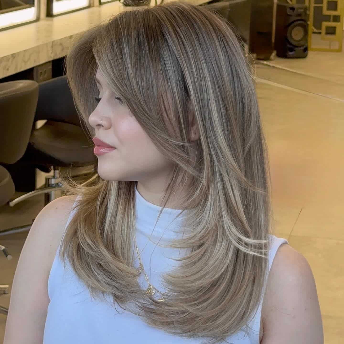 19. Straight Face-Framing Layers with Bangs in Golden Brown - Straight Hairstyles with Bangs