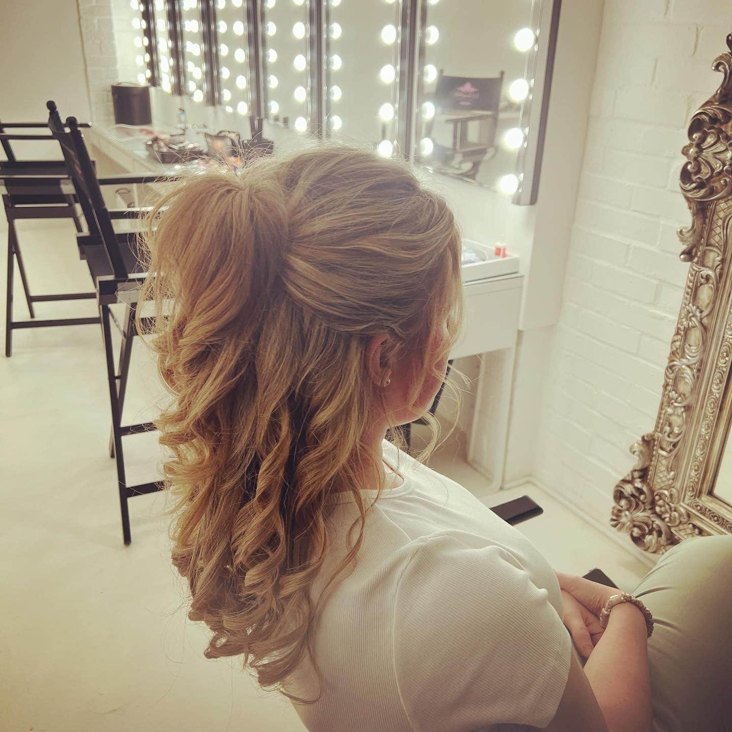 6. Classic Half-Up Ponytail with Defined Curls in Warm Golden Blonde - Prom Hairstyles